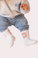 Paire de chaussettes Natif sunshine, avec un soleil rouge, style surf en coton bio pour les enfants