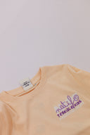 Etiquette t-shirt enfant surf Hossegor en couleur pêche