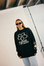 Sweat noir en coton bio et style oversize pour l'hiver avec des fleurs au format pixel de la marque Natif