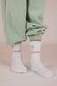 Paire de chaussettes blanche et verte pour les enfants avec le style e la marque de vêtements Natif