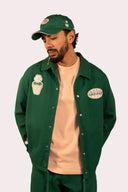 Veste verte avec des patch de fleurs, good vibes et Natif, coton bio pour homme et femme.