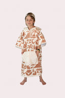 Poncho enfant couleur beige et crème au style surf avec capuche de la marque de vêtements Natif
