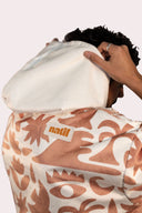 Poncho pour homme et femme couleur beige et crème au style surf avec capuche de la marque de vêtements Natif