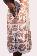 Poncho pour homme et femme couleur beige et crème au style surf avec capuche de la marque de vêtements Natif