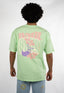 T-shirt natif good vibes porté une femme avec une fleur et des couleurs VERT, et violet en coton avec col rond