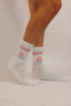 Paire de chaussettes Natif blanches avec sa fleur et son inscription feel good in your socks